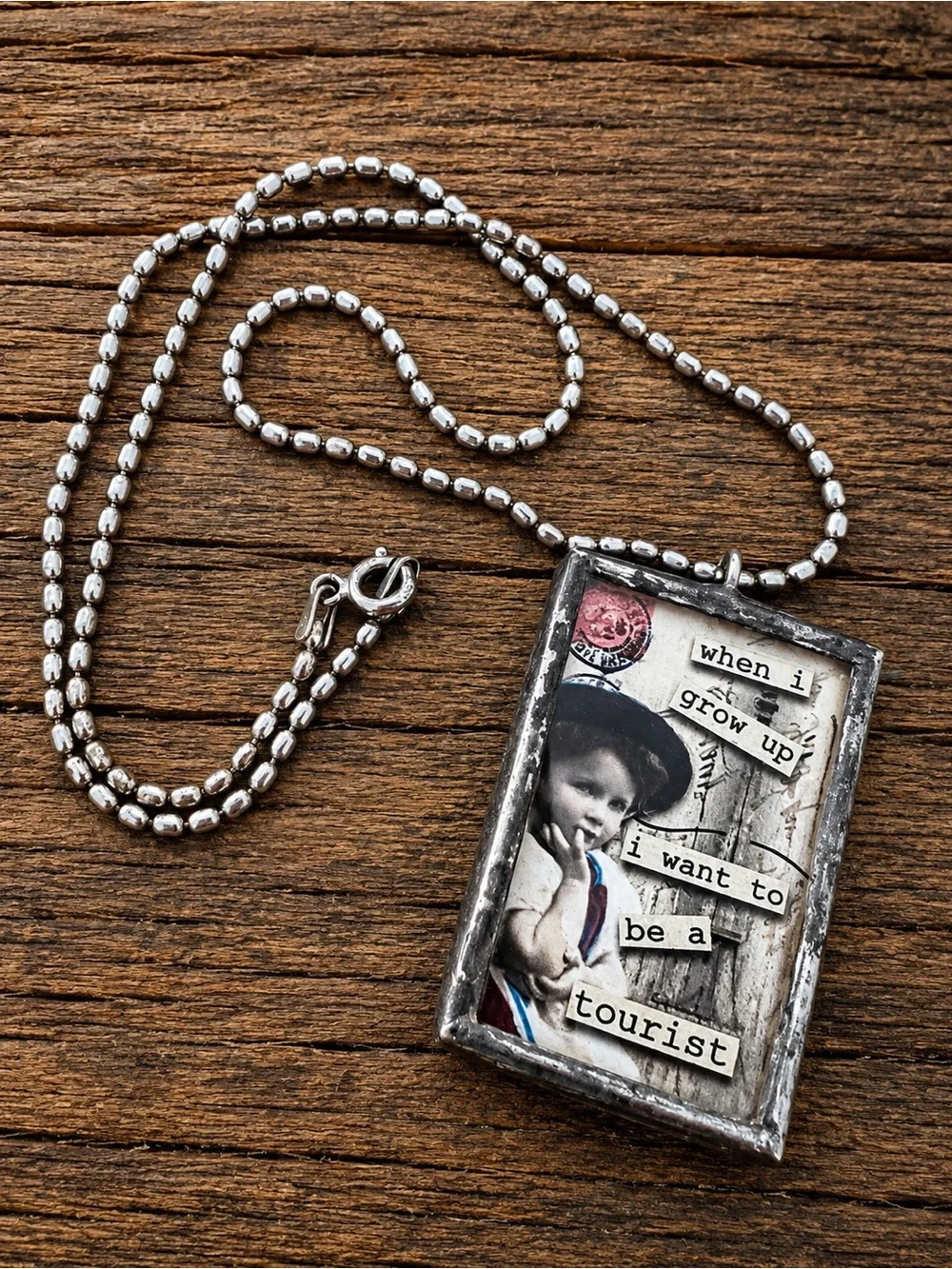 Vintage Style 'When I Grow Up I Want To Be A Tourist' Collage Pendant Necklace